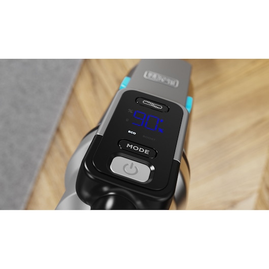BLACKDECKER BSV520BRB vacuum cleaner close-up showing digital display with blue screen and control buttons on wood floor.