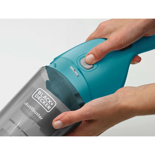 Photo of BLACK+DECKER WDB115WA handheld vacuum cleaner in teal, close-up of dustbuster body and controls.