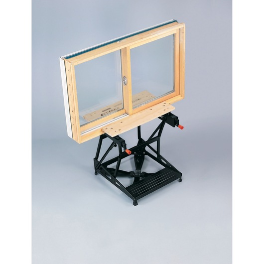 BLACKDECKER WM536 workbench side angle with wooden window frame clamped onto the surface.
